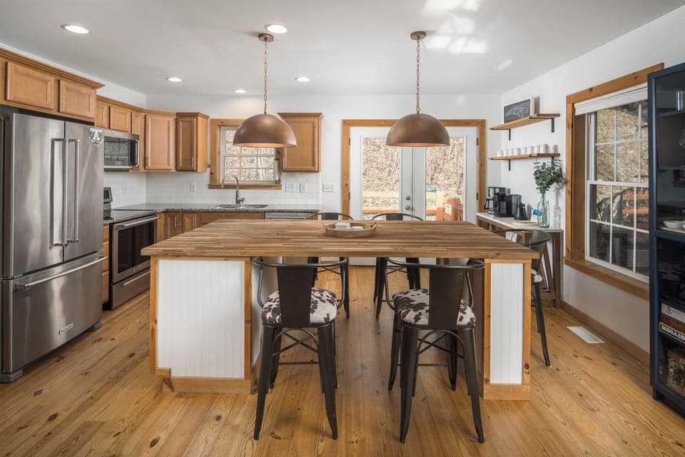 A functional workspace with room for multiple people to help with dinner or snacks.