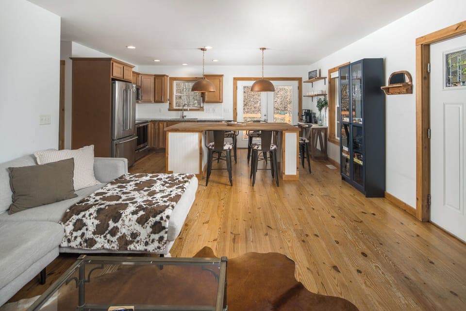 A wide butcher block island where the group can gather for meals and planning the day.
