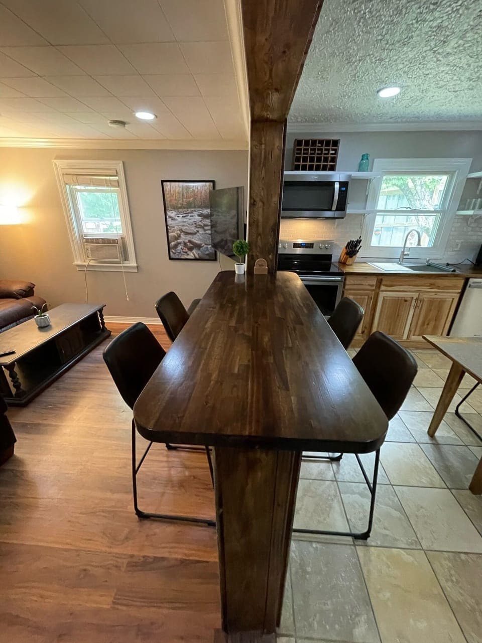 Dining area with bar seating and full kitchen in Brevard NC home