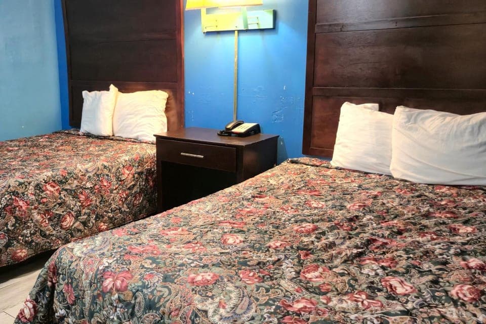 Drift off with soft lamp light and shared nightstand.