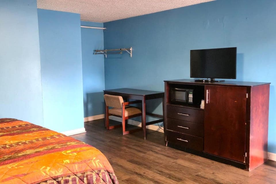 Settle in with TV entertainment and a dedicated work table.