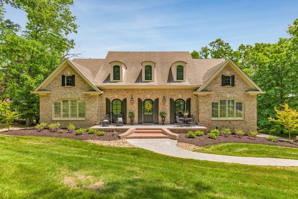 Welcome to your private Franklin retreat—a beautifully renovated brick home nestled on a serene acre overlooking the 8th hole of Temple Hills Country Club.