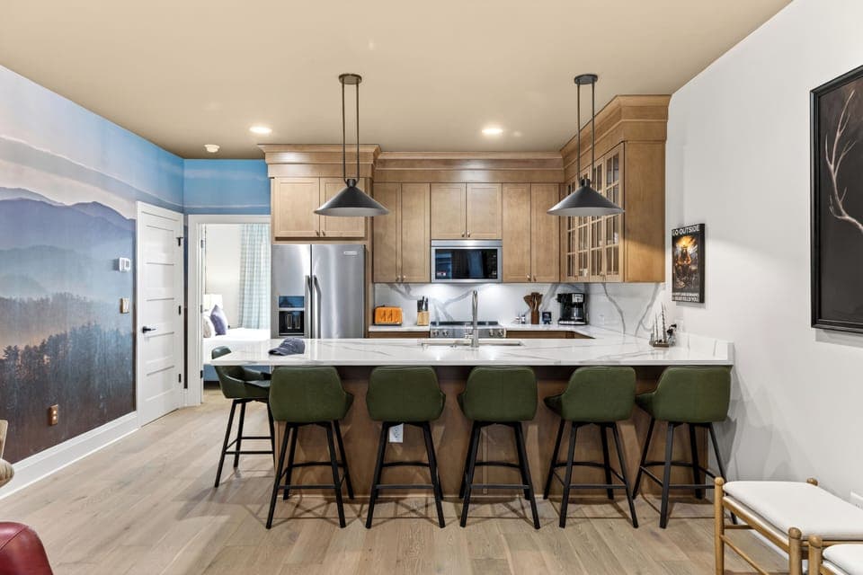 Fully equipped kitchen with a roomy island—grab a seat at the breakfast bar and keep the conversation going. (The Lodge)