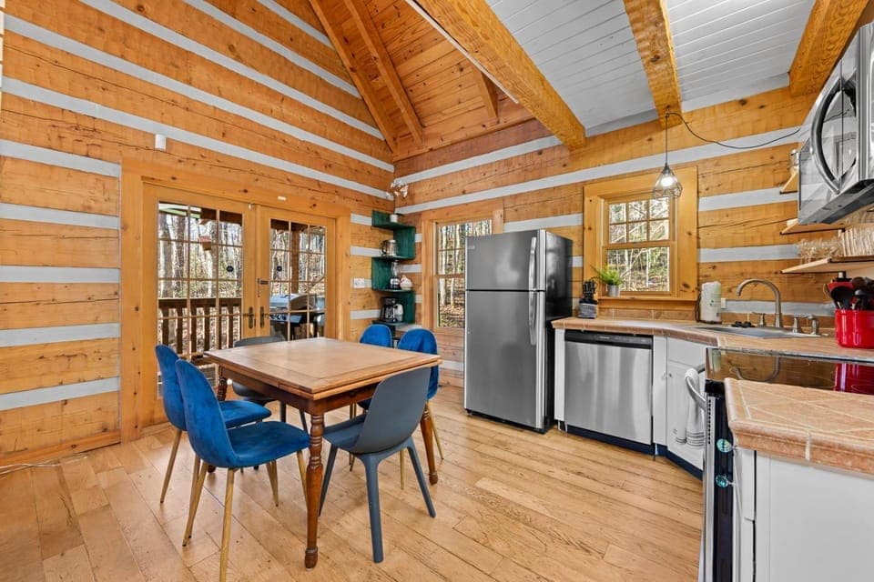 Gather around the cozy dining table, perfect for sharing meals and stories.