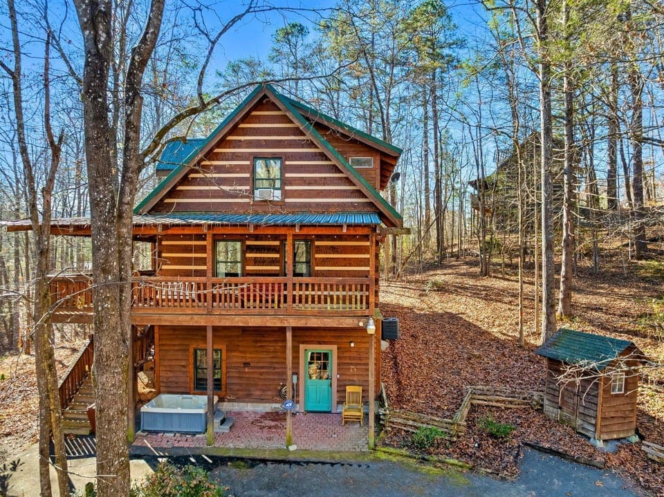 Immerse yourself in nature with a quaint cabin retreat surrounded by forest and warm rustic details.