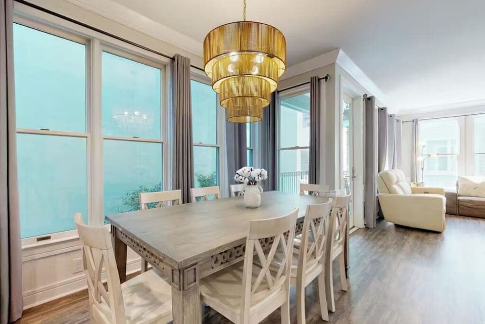 Gather around this elegant dining table where golden light creates the perfect ambiance for memorable meals with loved ones.