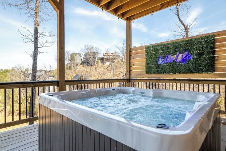Soak in your private hot tub while enjoying lake views from this covered deck sanctuary.