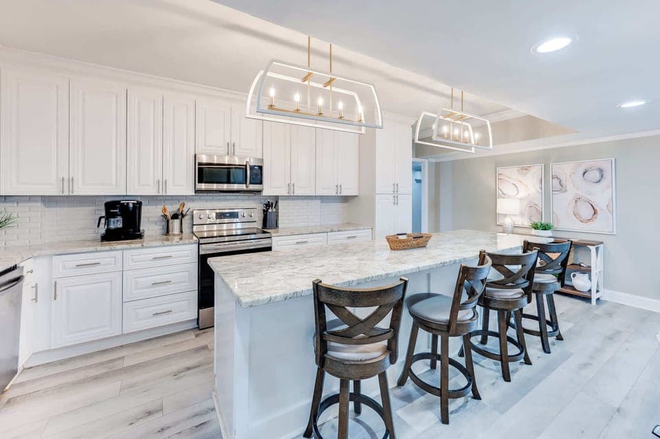 Enjoy cooking and entertaining in Chef's kitchen with 4 barstools at kitchen island