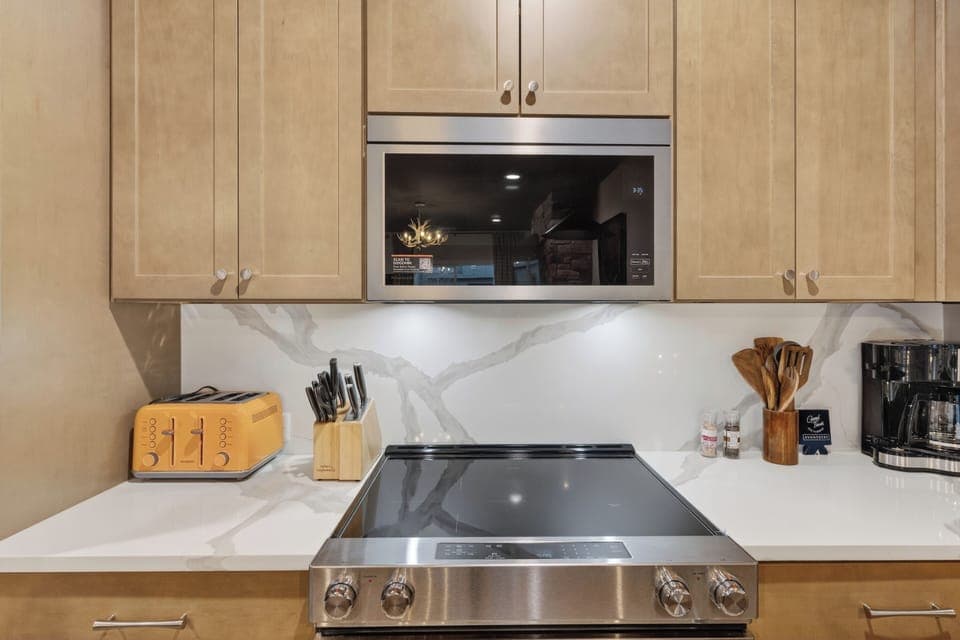 Fully equipped kitchen with a roomy island—grab a seat at the breakfast bar and keep the conversation going. (The Lodge)