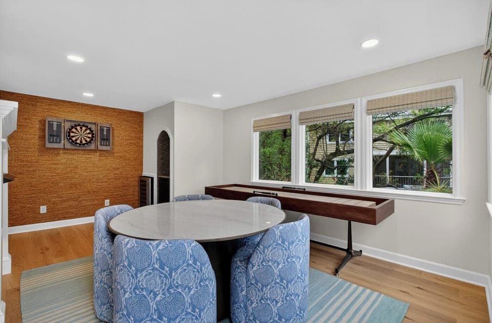 Challenge friends to darts or pool in your private game room, where natural light streams through large windows onto polished floors.