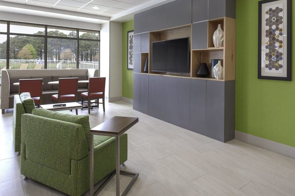 Relax in the airy lounge with big windows and seating