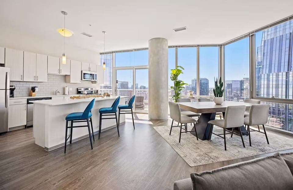 Host memorable dinners beside wraparound windows and skyline scenery.