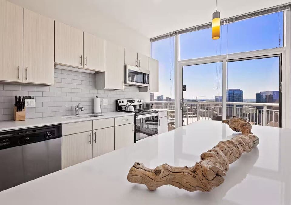 Cook together in a sunlit kitchen with sweeping city views.