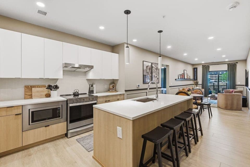 Fully equipped kitchen with modern appliances and ample counter space perfect for cooking a meal. Large island including seating for 4.
