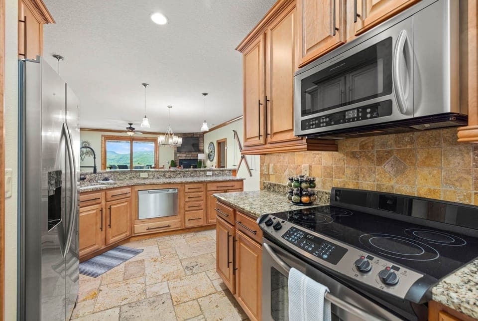Kitchen view open to dining and living areas