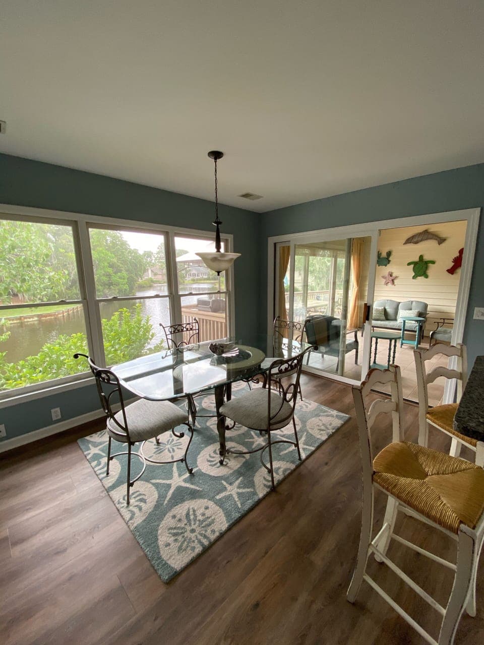 Kitchen table, 4 bar stools and water view.