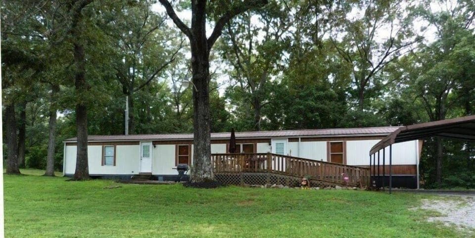 Front and a portion of the 2 car carport
