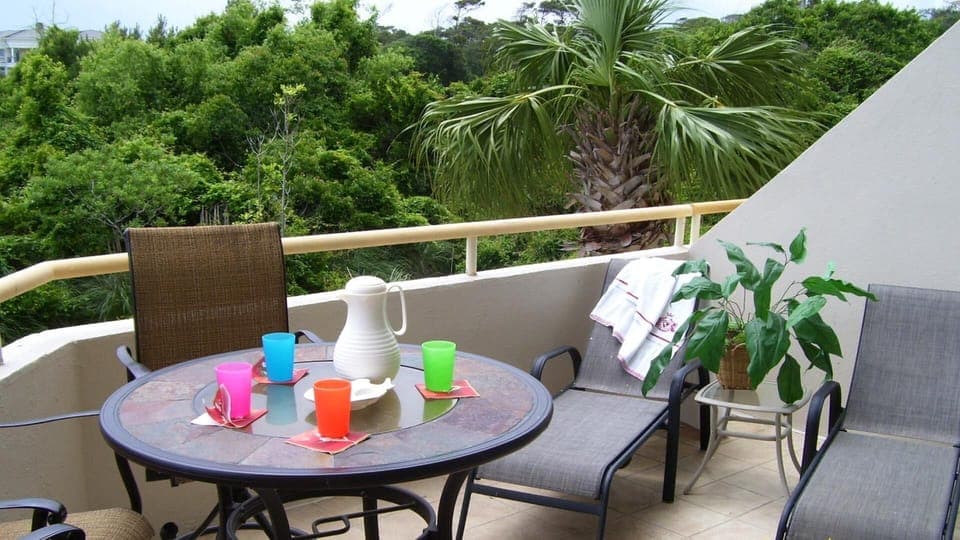 Relax in the balcony lounges with a good book or cool beverage. 