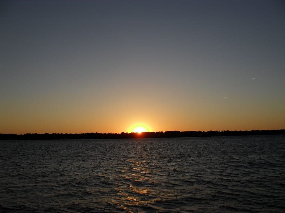 View of sunset over Dufuskie island from the beach