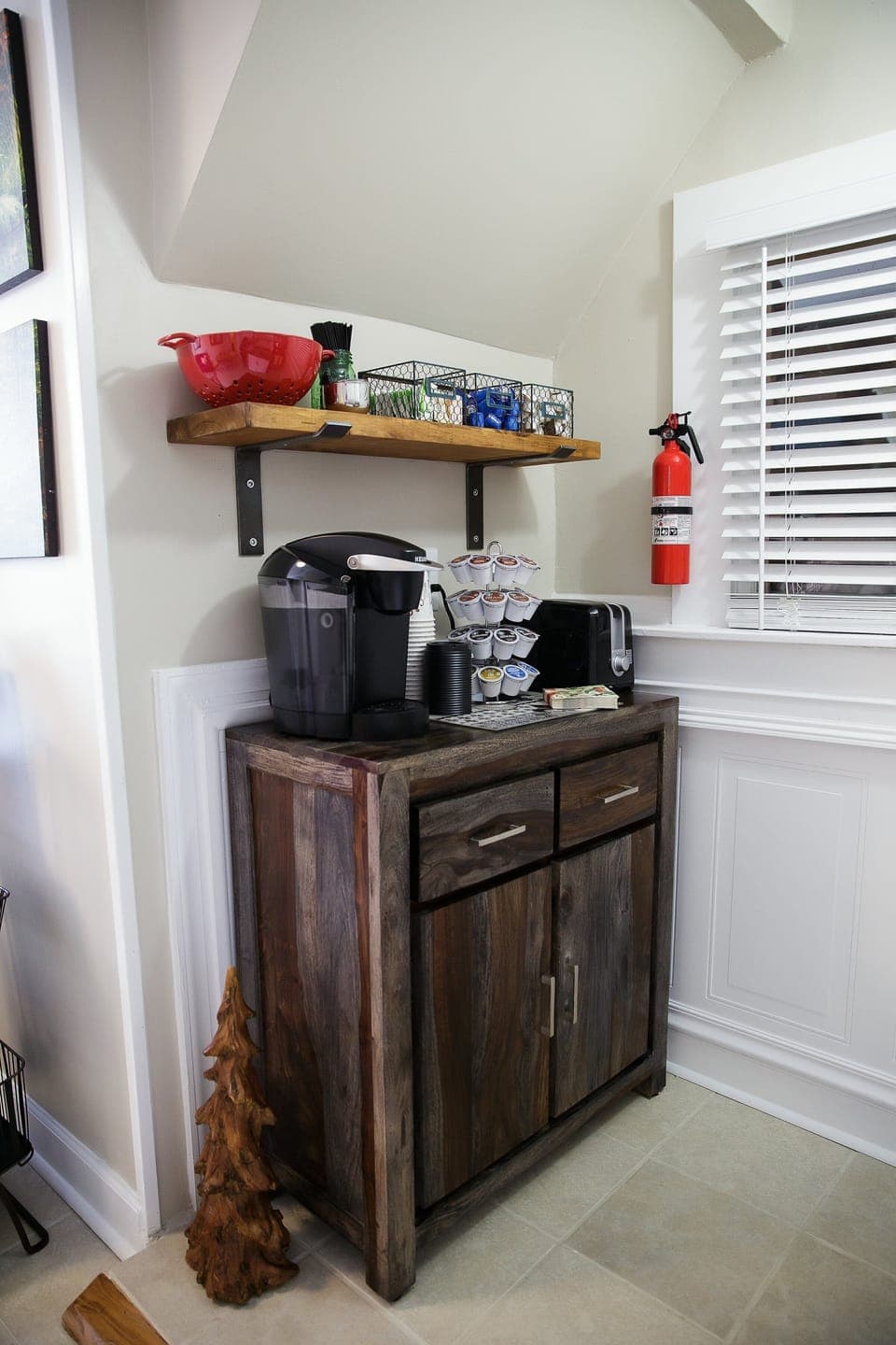 Keurig with variety of coffees, teas and condiments. 