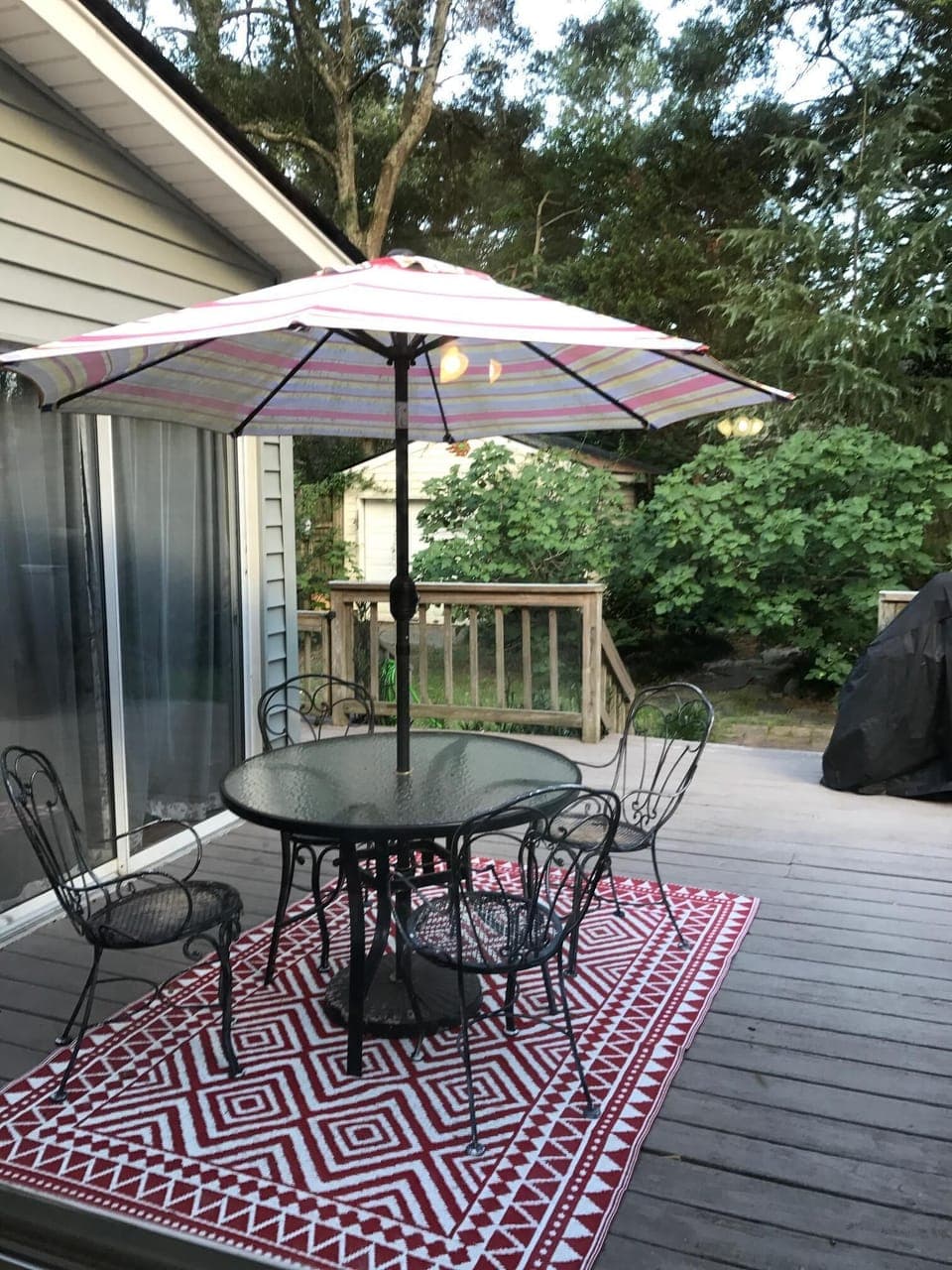 Cozy outdoor patio with gas & charcoal grills for relaxing and entertaining 