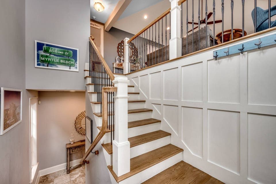 Entryway to the home. The main living space and primary are upstairs while the other three bedrooms are down a flight of stairs.