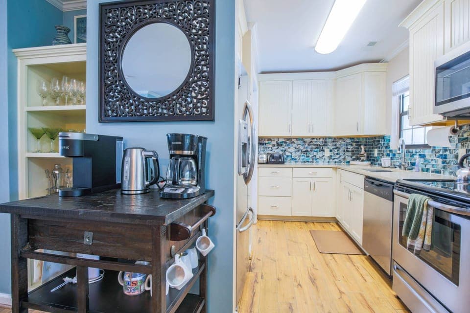 There is a coffee bar situated in between the kitchen and dining room.