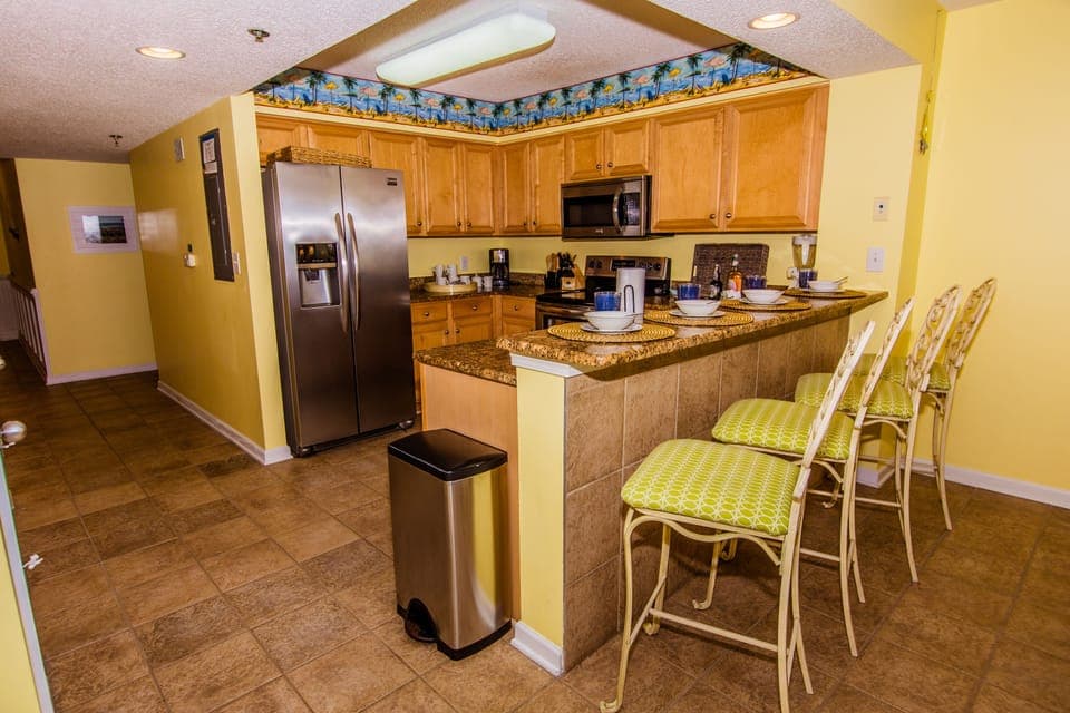Updated kitchen with all of the extras, as well as breakfast bar seating for 4.