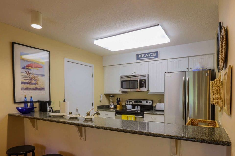 You'll find a beach cart, beach umbrella and beach chairs in the kitchen pantry closet.