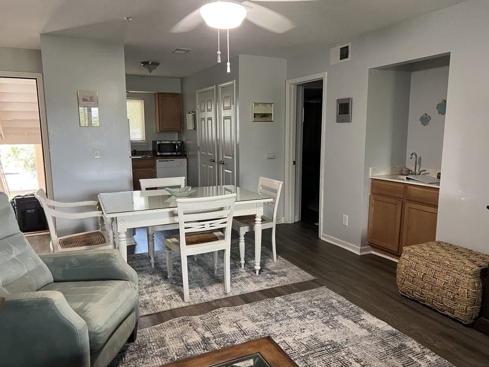 Living room to kitchen view; dining table