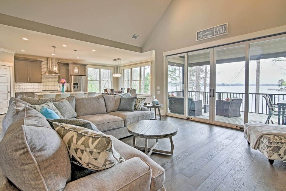 Natural light fills the open living space through the wall of windows.