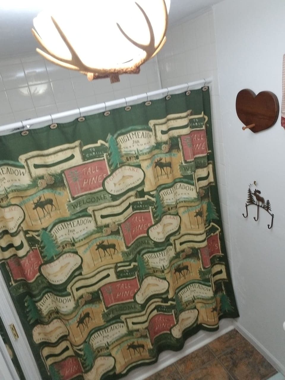 Bathroom #2 with tub/shower, toilet and sink.