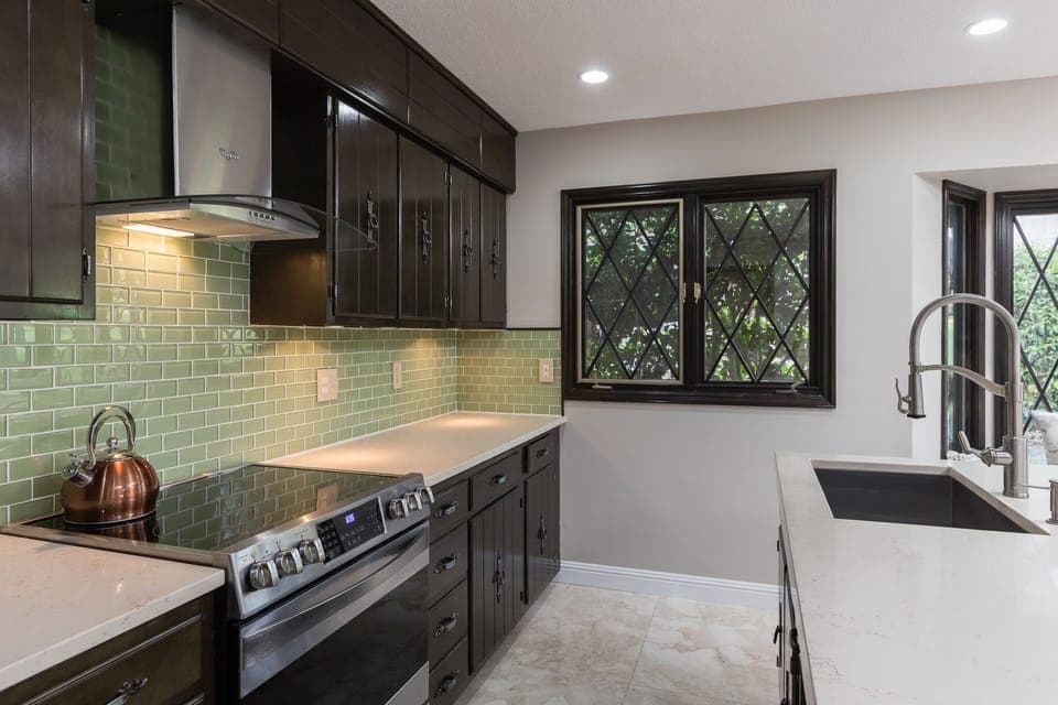 Designer Appliances in the Kitchen with beautiful Custom Backsplash