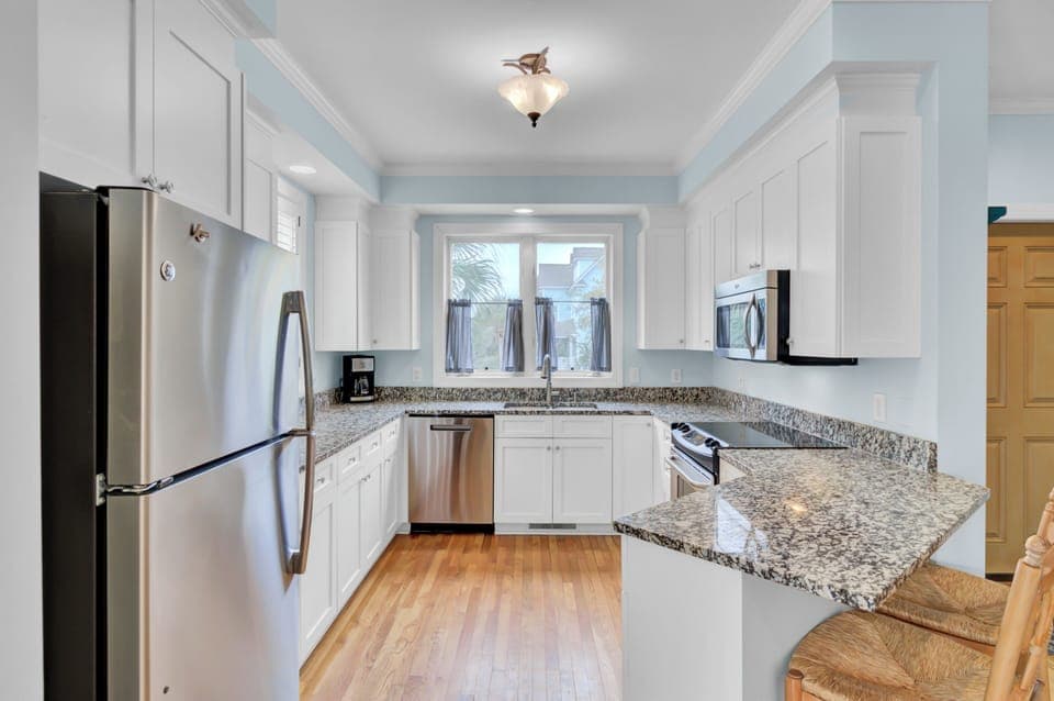 Whip up meals in your spacious kitchen featuring granite counters, stainless appliances, and plenty of cabinet storage for all your vacation essentials.