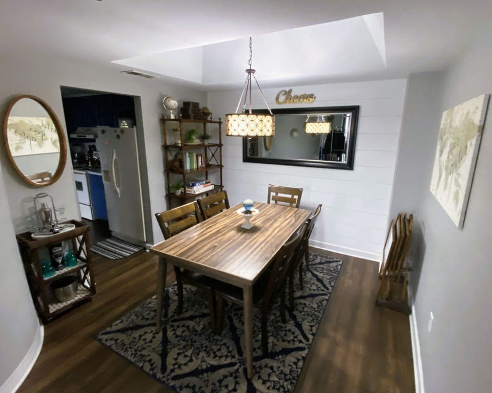 Dining area with bar cart and a book nook for those who love to read.