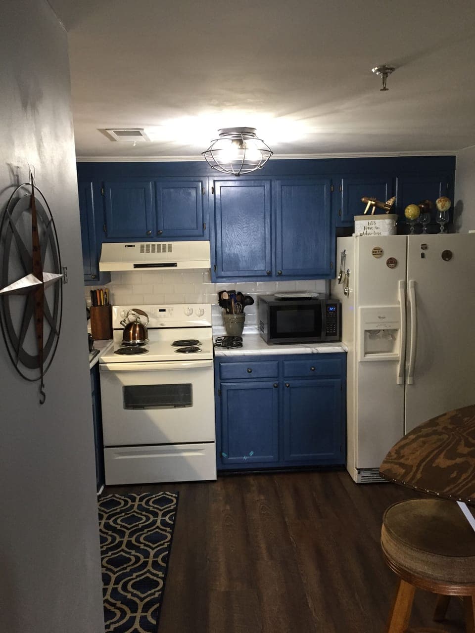 Kitchen filled with great cookware, utensils, lovely dishes and drinkware. 