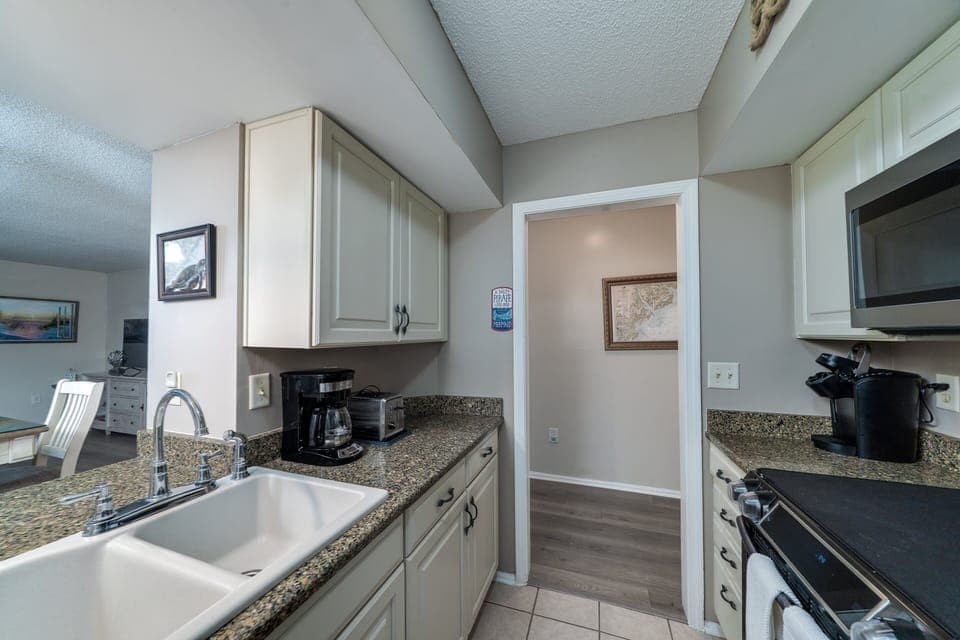 Kitchen with stainless steel appliance and all the makings for a delicious gourmet meal.