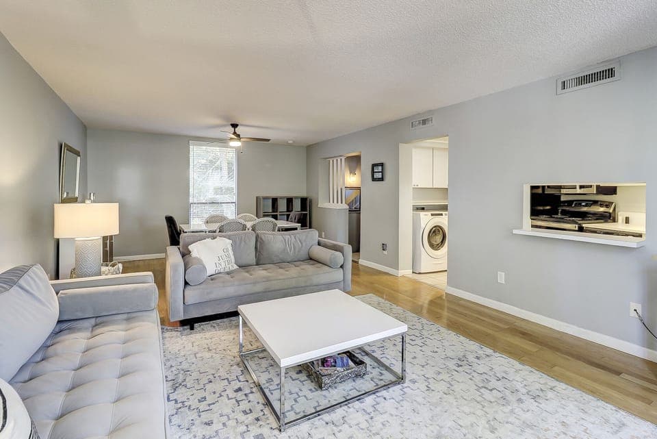 Bright, spacious living area next to kitchen. 