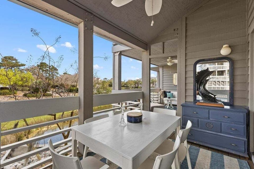 Outdoor porch with seating for 6 which connects to sitting area off the primary