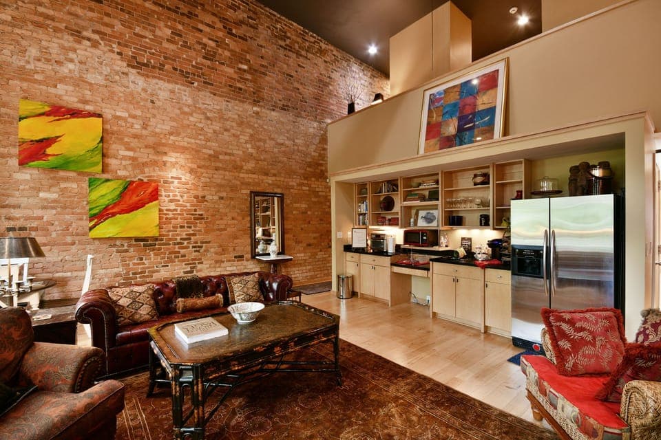Kitchenette and seating area with large granite counters for food prep. 