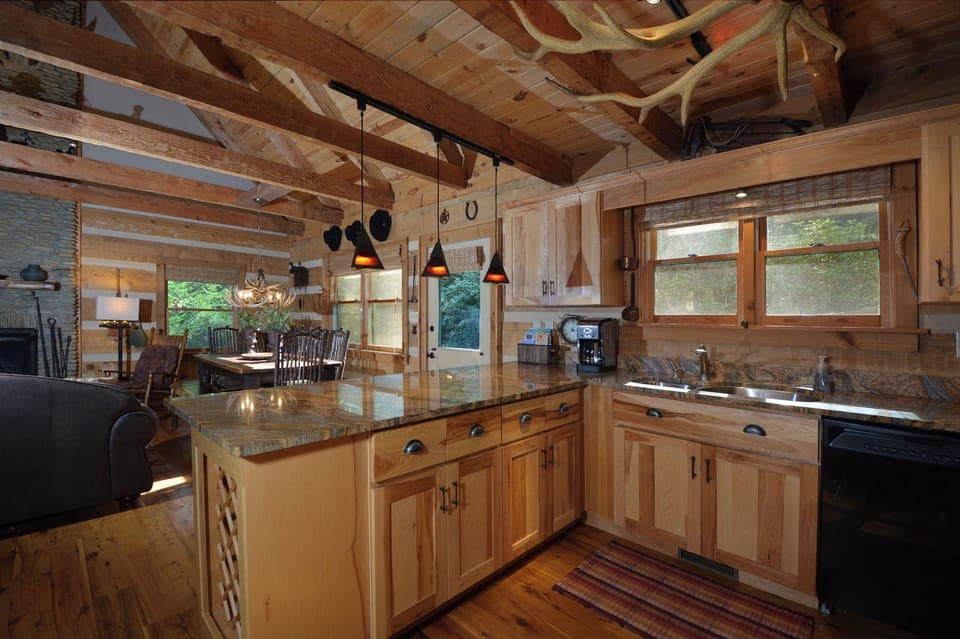 Fully stocked kitchen with high-end granite tops and appliances