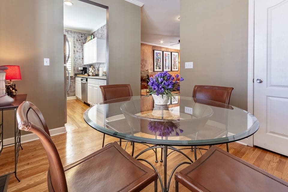 Dining area with pantry looking into kitchen and living area