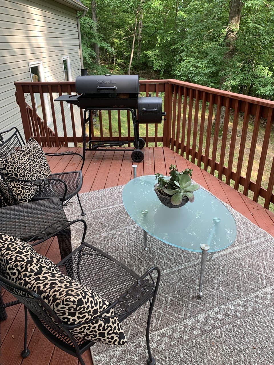 Back deck feels like you are in a  treehouse
Seating areaplus charcoal grill