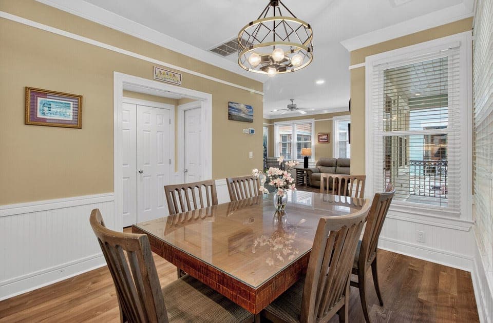 Gather around your elegant dining table for memorable meals under beautiful pendant lighting.