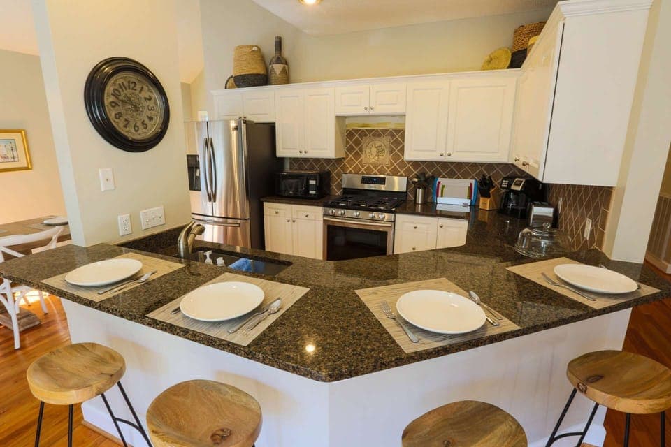 The cozy kitchen counter easily seats 4 people.