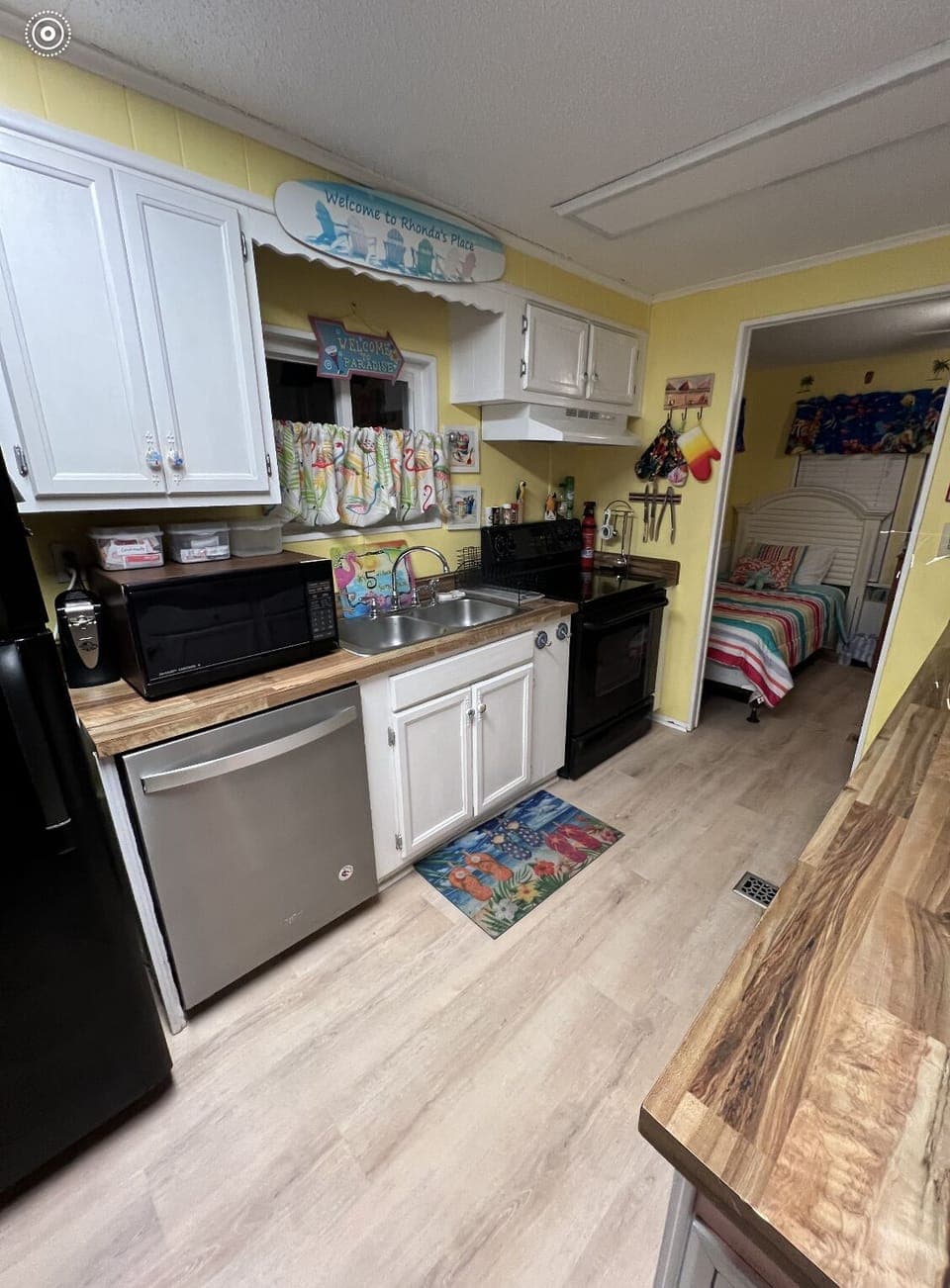 Kitchen with microwave, dishwasher.  Fully stocked