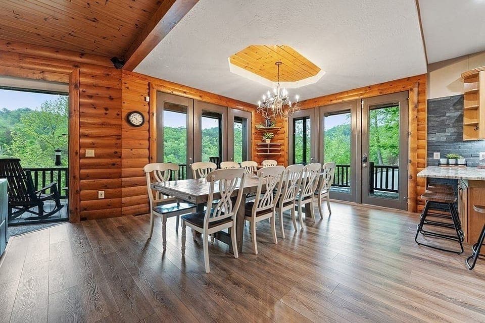 Room for 10-12 at table, plus 4 more at the kitchen counter