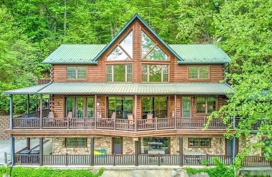 Log cabin perched on a peaceful mountain ridge with views of the river below
