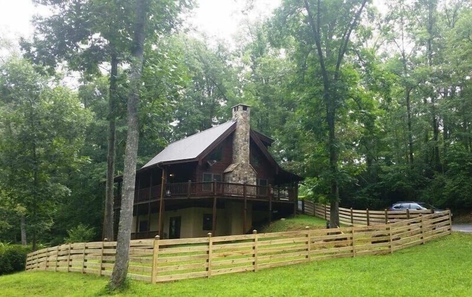 Cabin nestled in woods next to Big Brasstown Creek