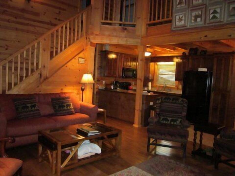 View of livingroom and kitchen; stairs to upper level